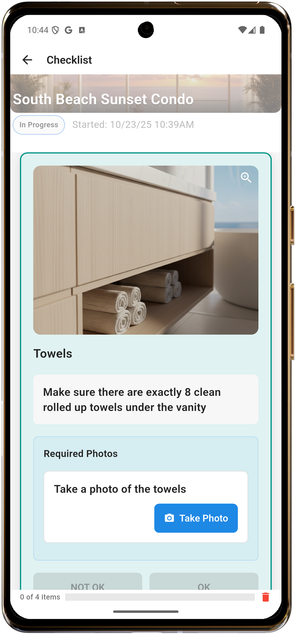 Team member checking towels item with reference photo before taking verification photo