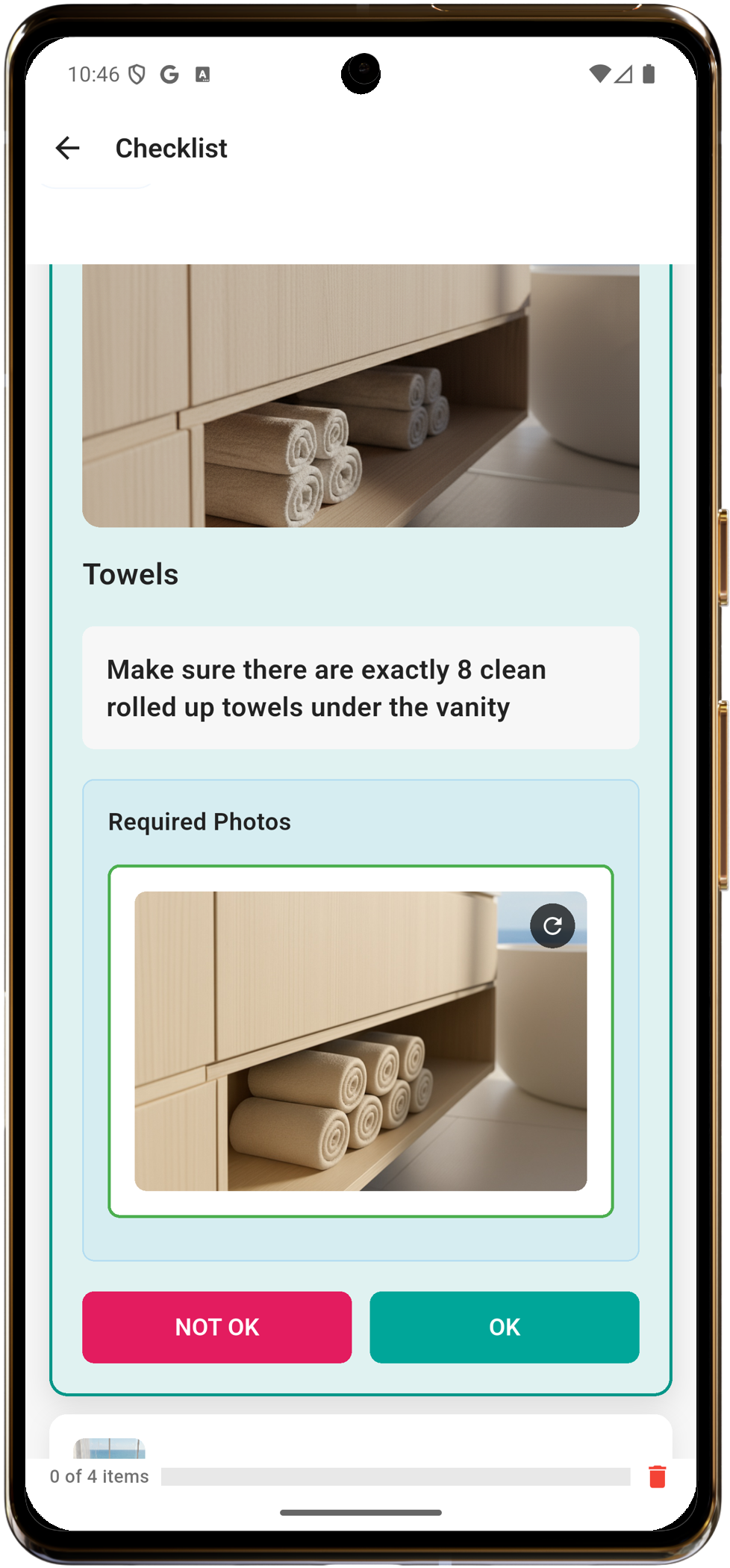 Team member reviewing towels photo with OK and NOT OK buttons